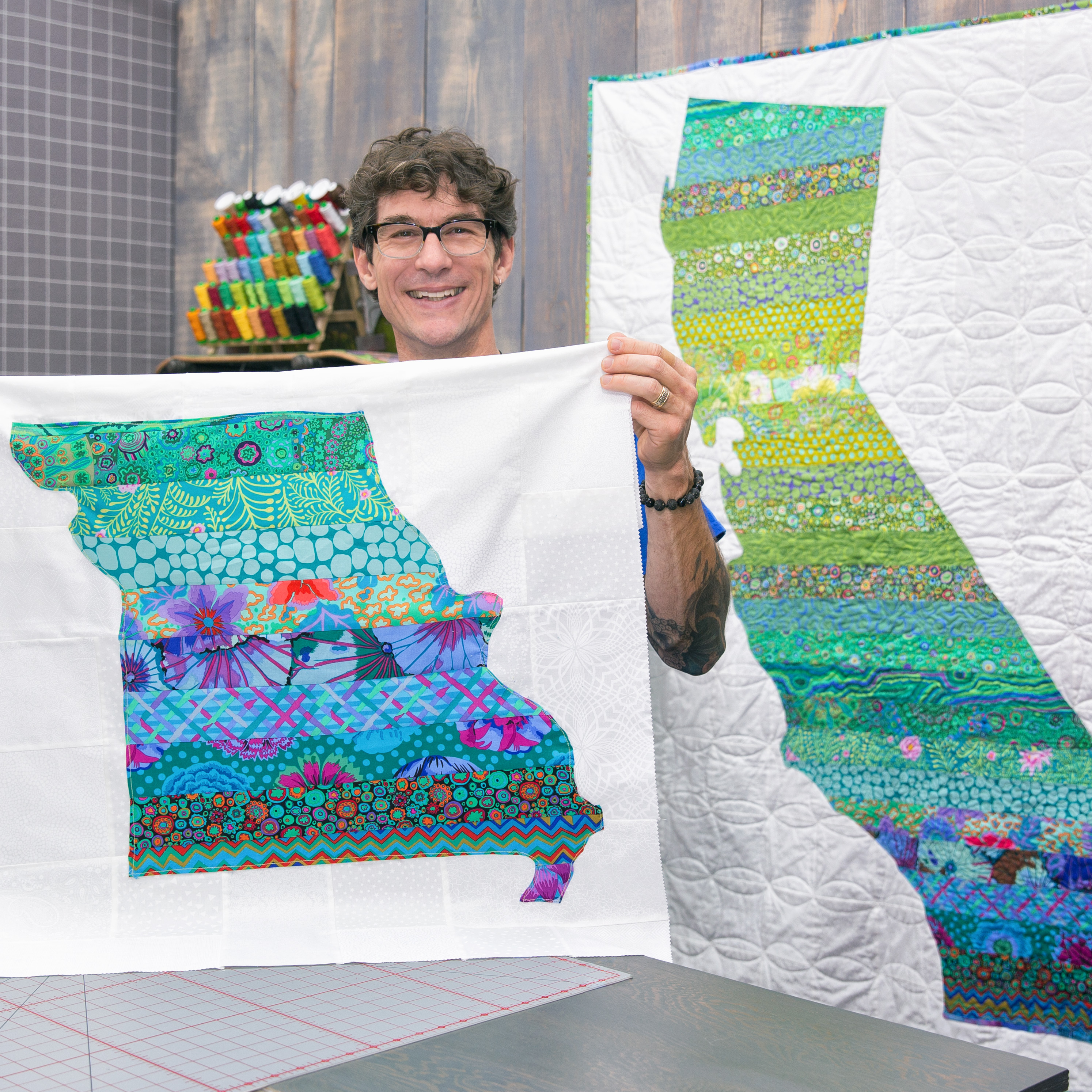 state-map-appliqu-quilt-man-sewing